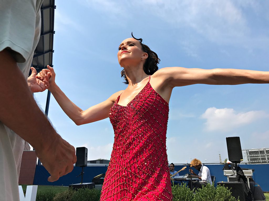 NEW YORK, NY - SEPTEMBER 10:  Professional salsa dancer Kirsten O'Brien Cha Chas with spectator Damian Mojica from Brooklyn during Day Thirteen of the 2016 US Open at the USTA Billie Jean King National Tennis Center on September 10, 2016 in Queens.  (Landon Nordeman for ESPN)