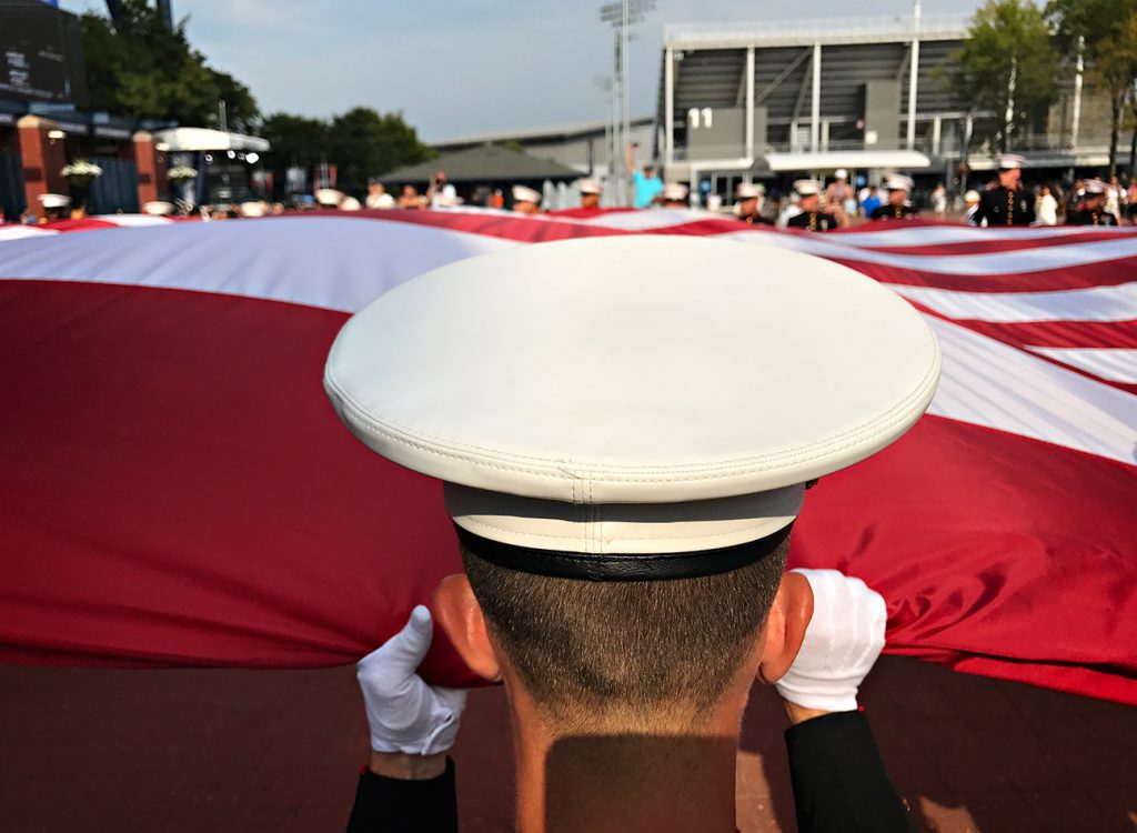 NEW YORK, NY - SEPTEMBER 10: Active Marines 6th Communication Battalion from Brooklyn, NY march back outside Arthur Ashe Stadium after the opening ceremony to the Women's Championship Final to fold the American Flag.  Day Thirteen of the 2016 US Open at the USTA Billie Jean King National Tennis Center on September 10, 2016 in Queens.  (Landon Nordeman for ESPN)